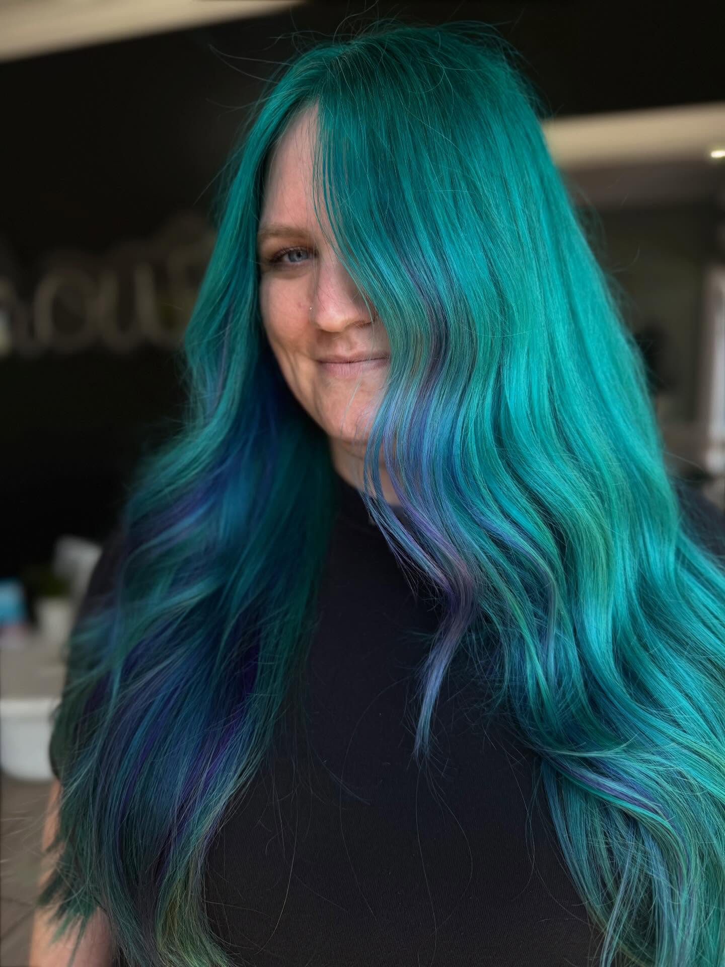 Long turquoise hair with violet ribbons
