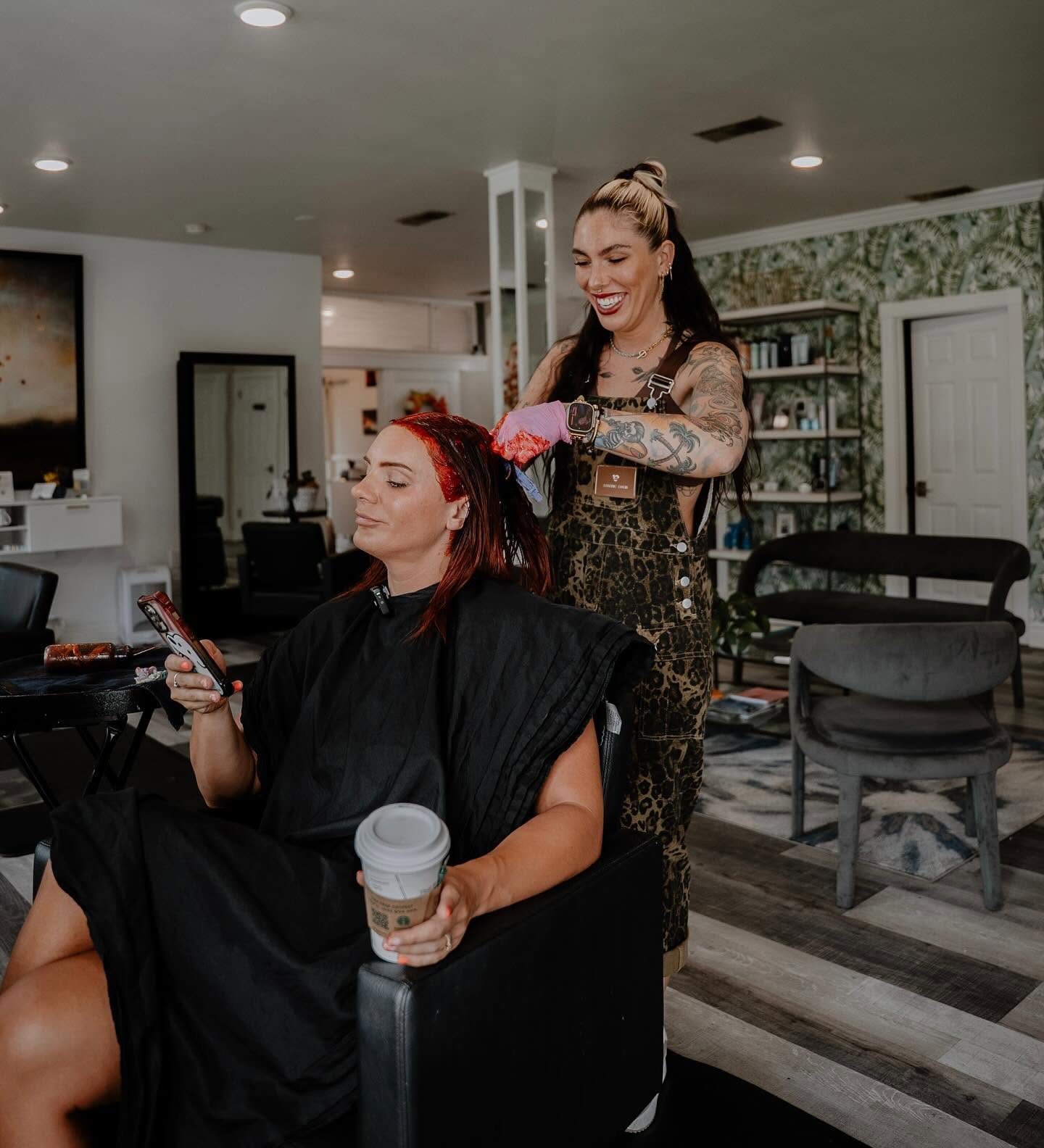 Makenna smiling while creating custom color for her client